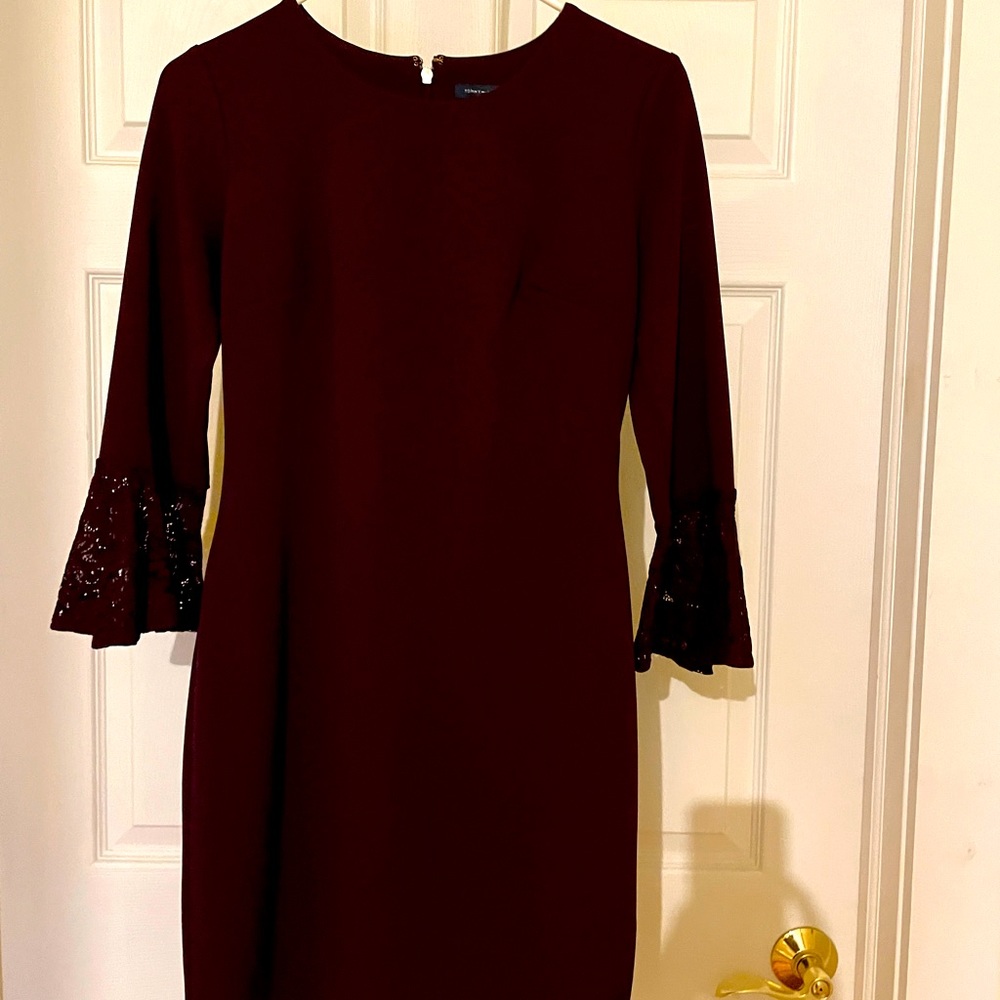 Elegant eggplant color dress with lace flare at elbow